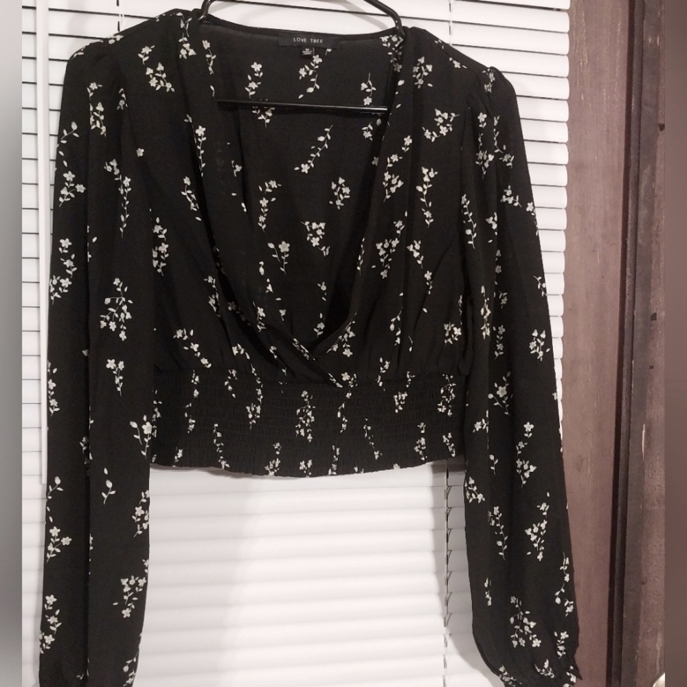Flower, smock waisted, long sleeved, a little see thru sexy and fun! Black tranl